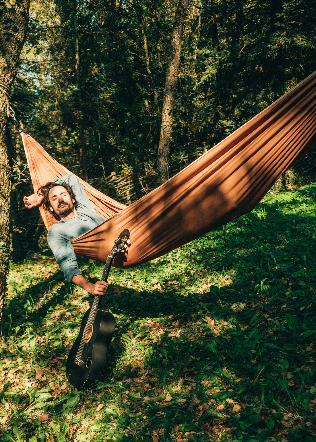 Man Relaxing in Hammock